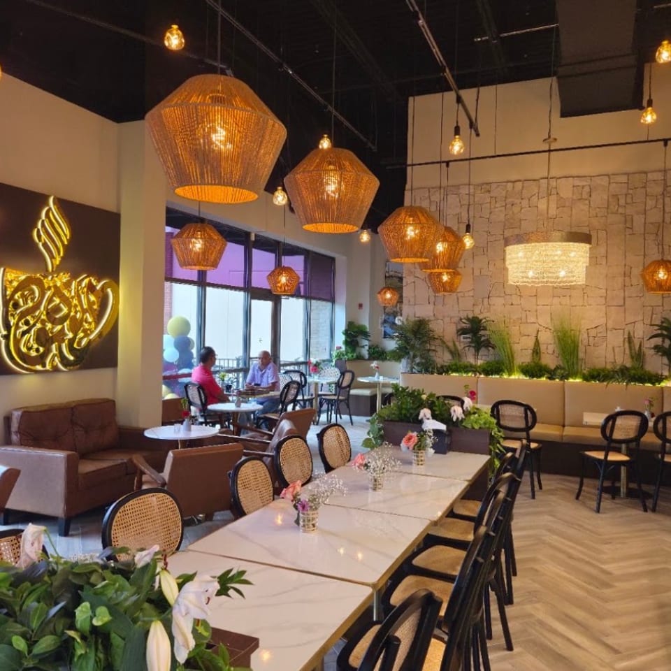 High Point dining room with warm pendant lights.